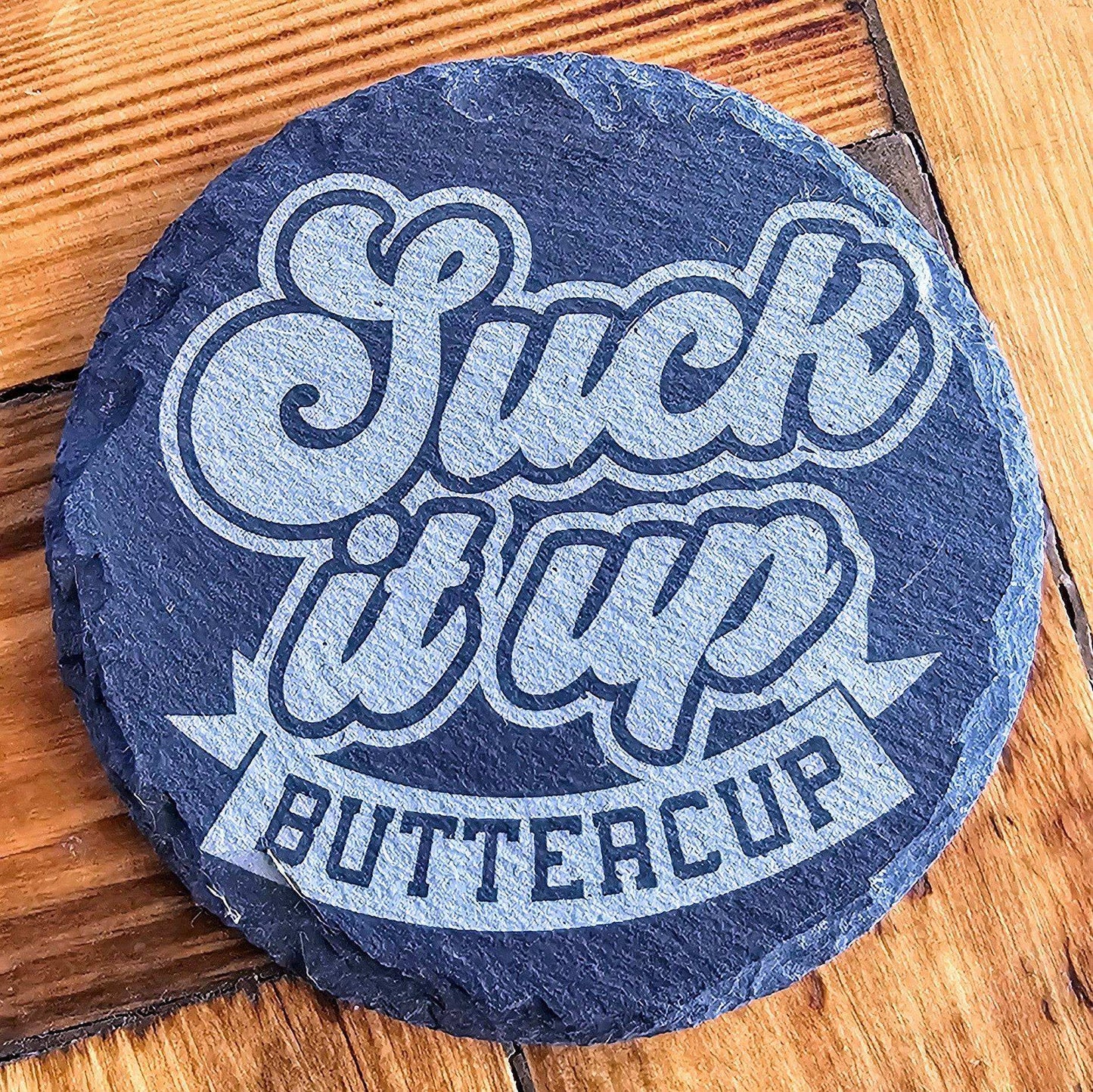 a stone that says stick up buttercup on it