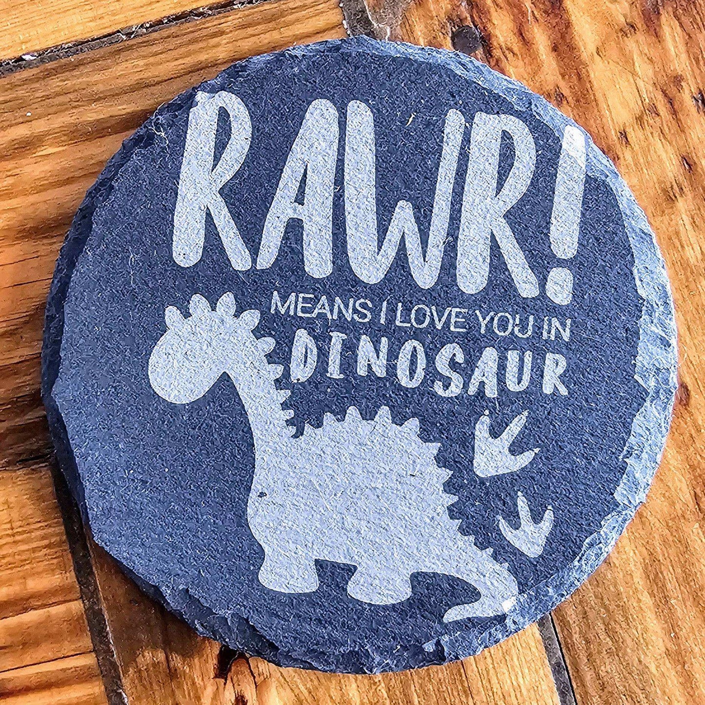 a stone that says raw means i love you in dinosaur