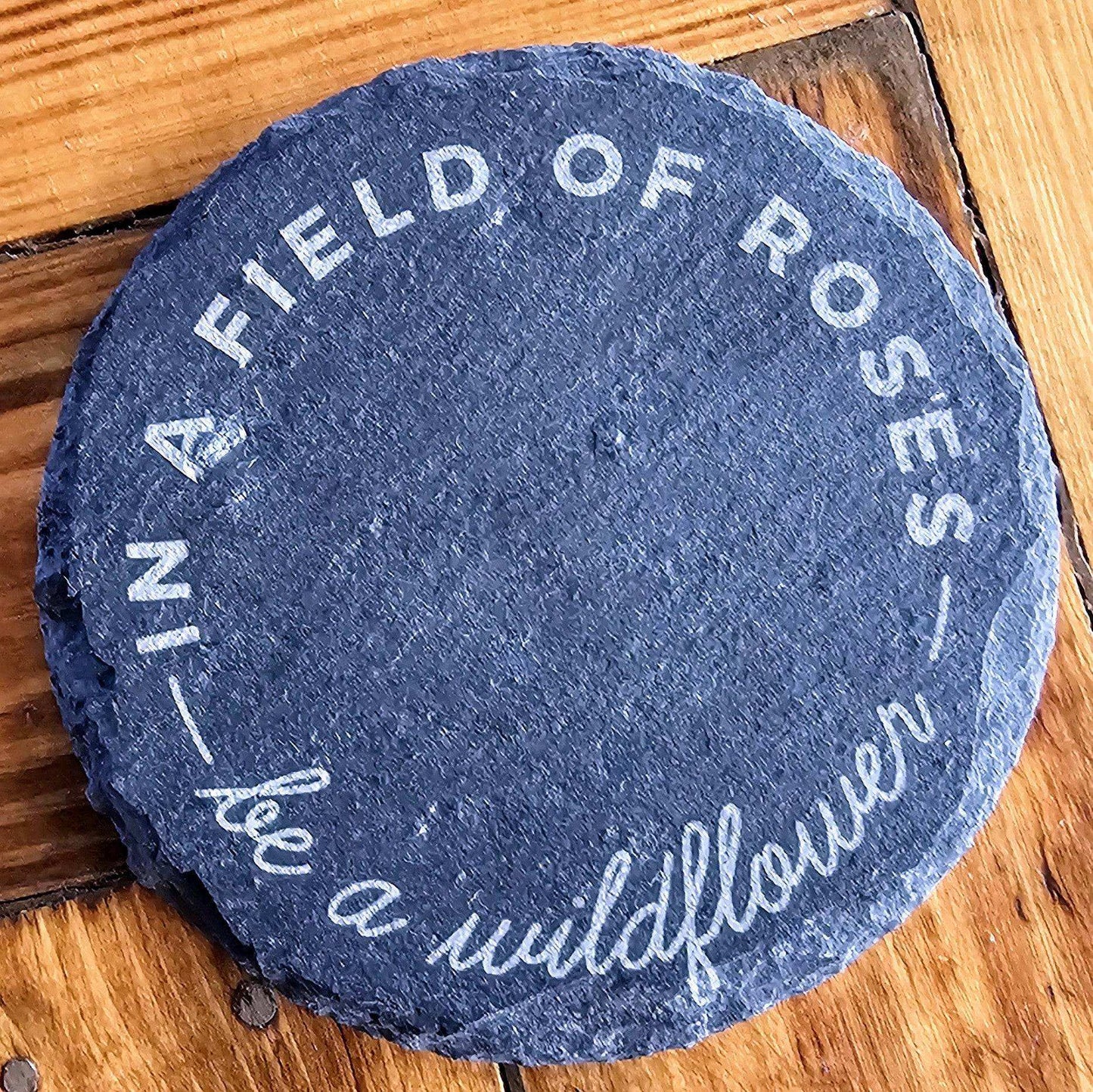 a blue stone with white writing on it