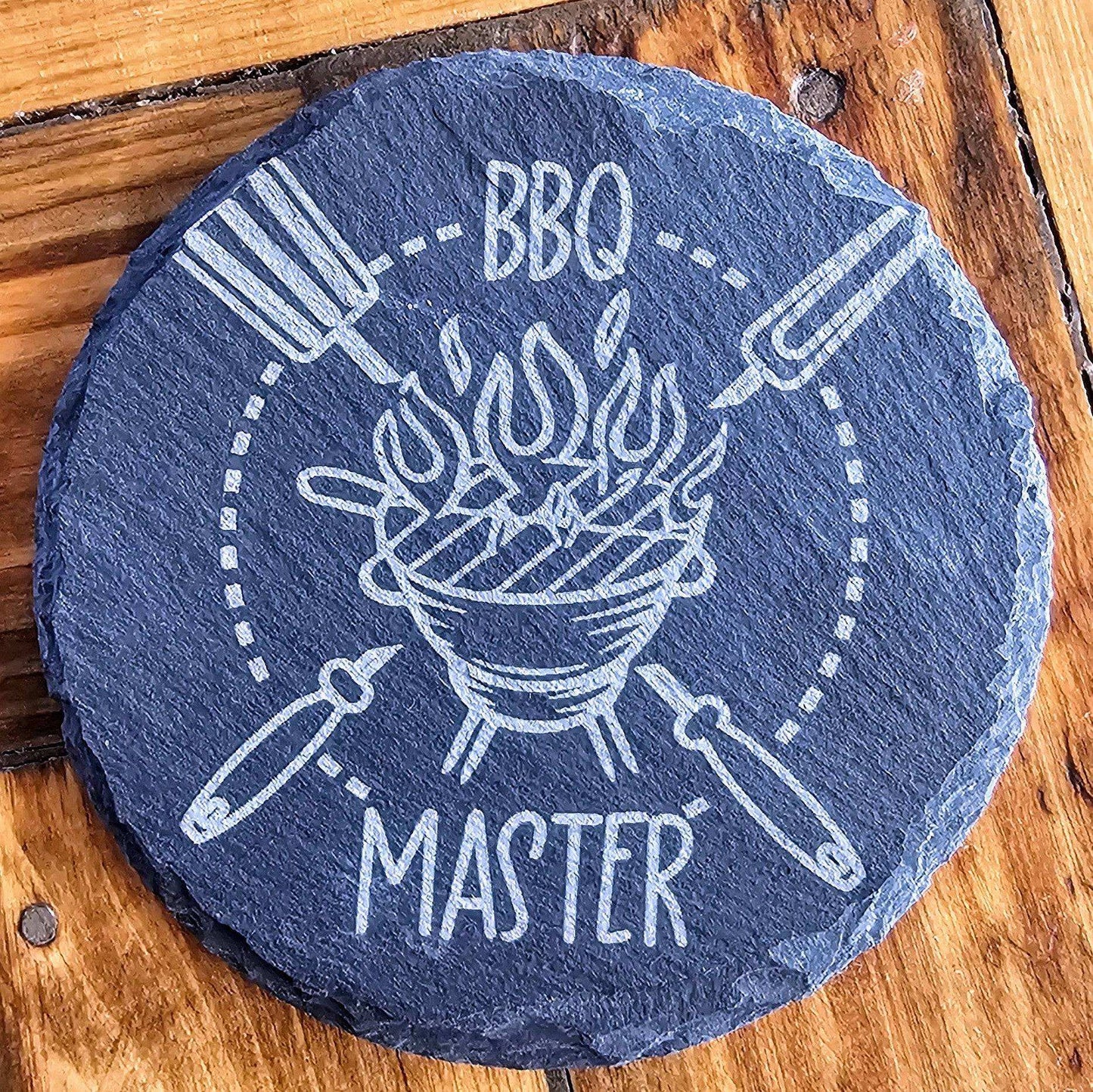 a stone that says bbq master on it