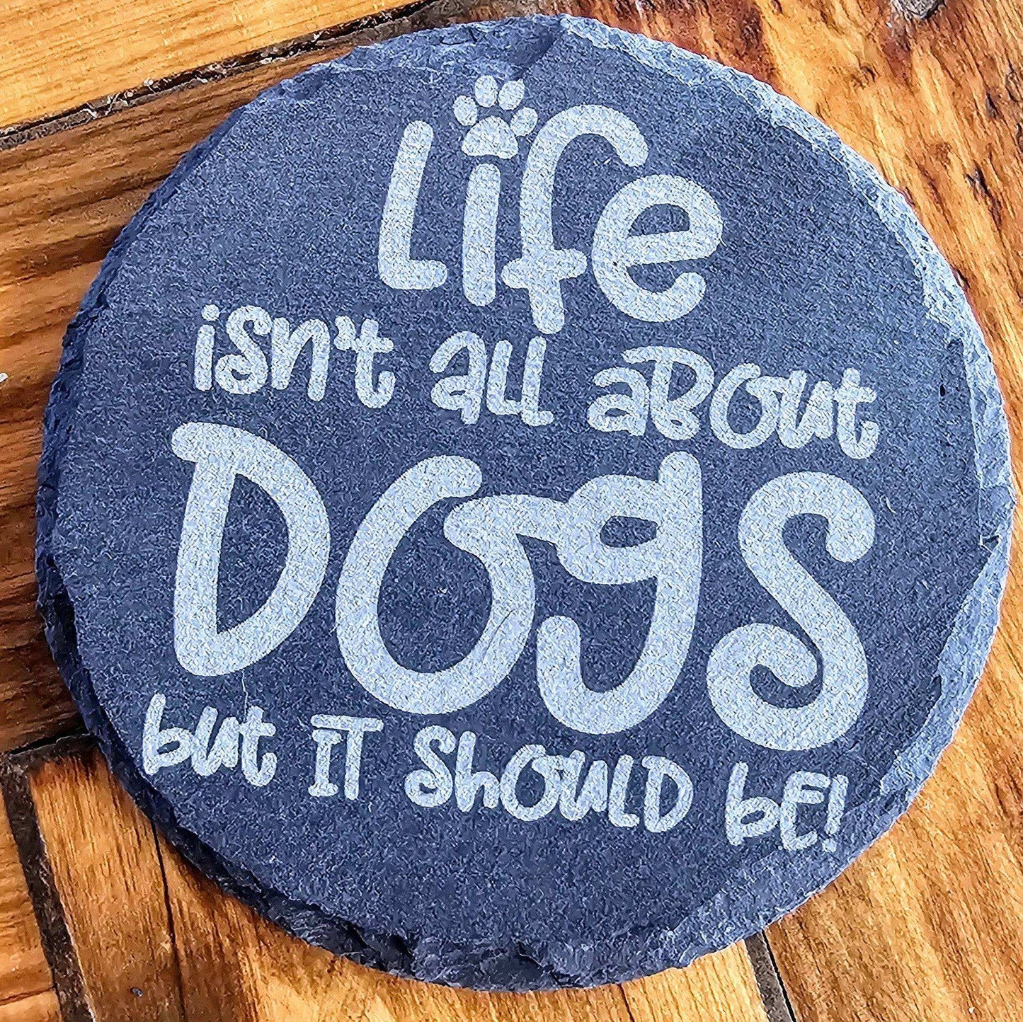 a stone that says life isn't all about dogs but it should be