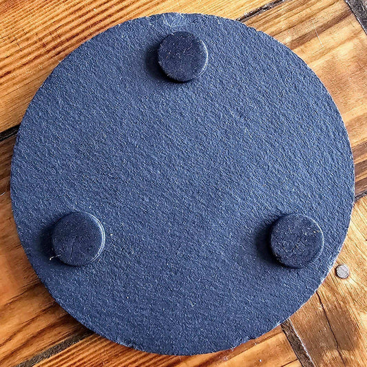 a wooden table topped with a blue circular object