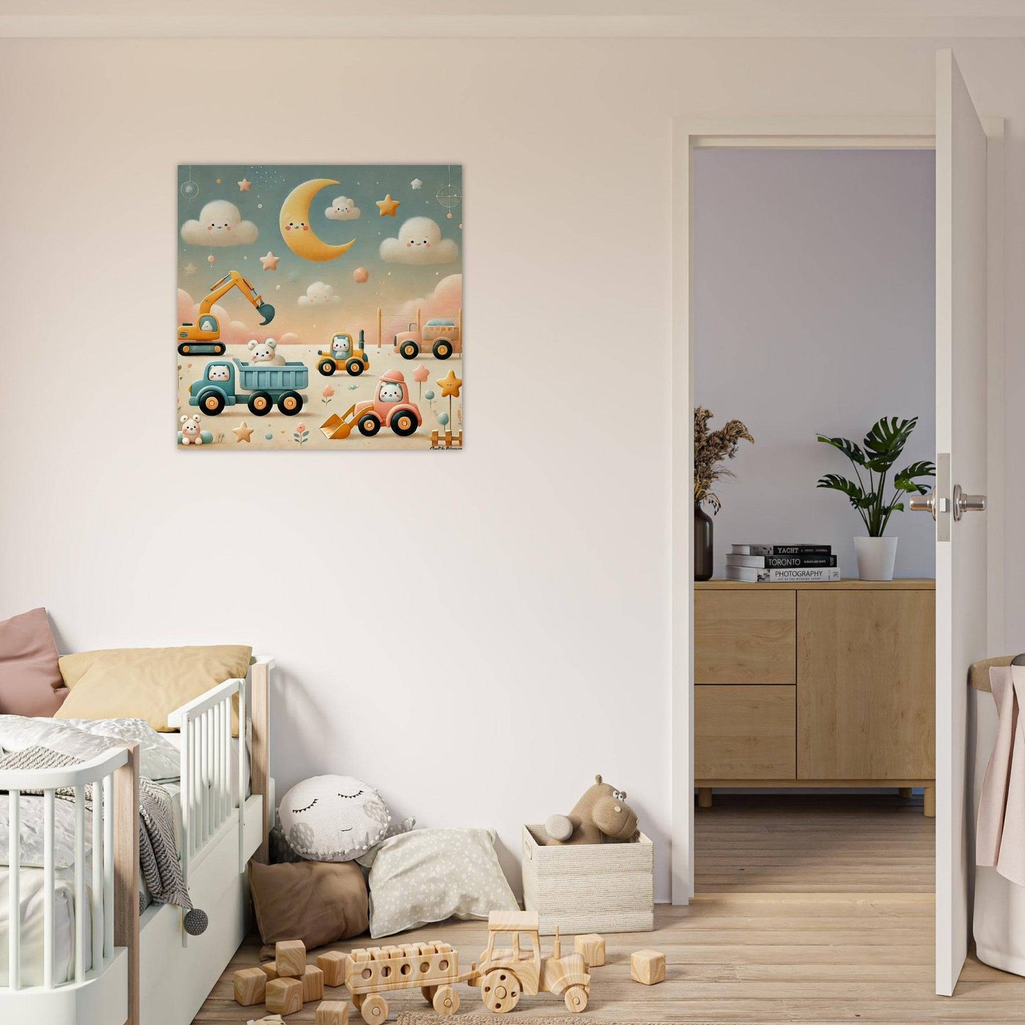 a baby's room with a crib and a painting on the wall