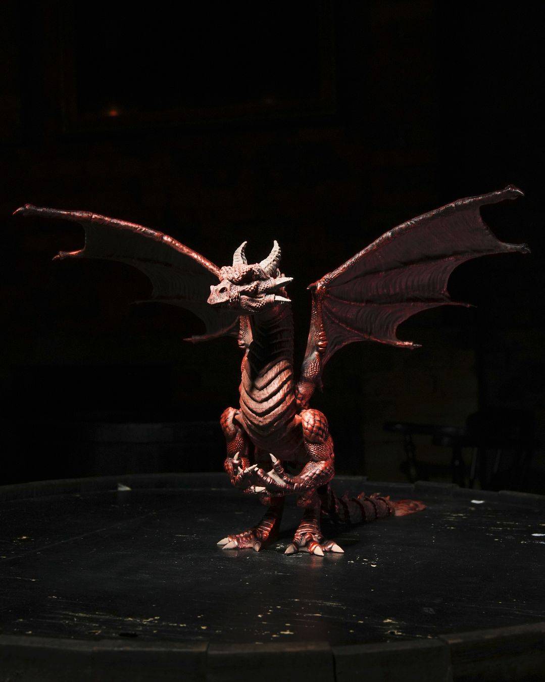 a statue of a dragon sitting on top of a table