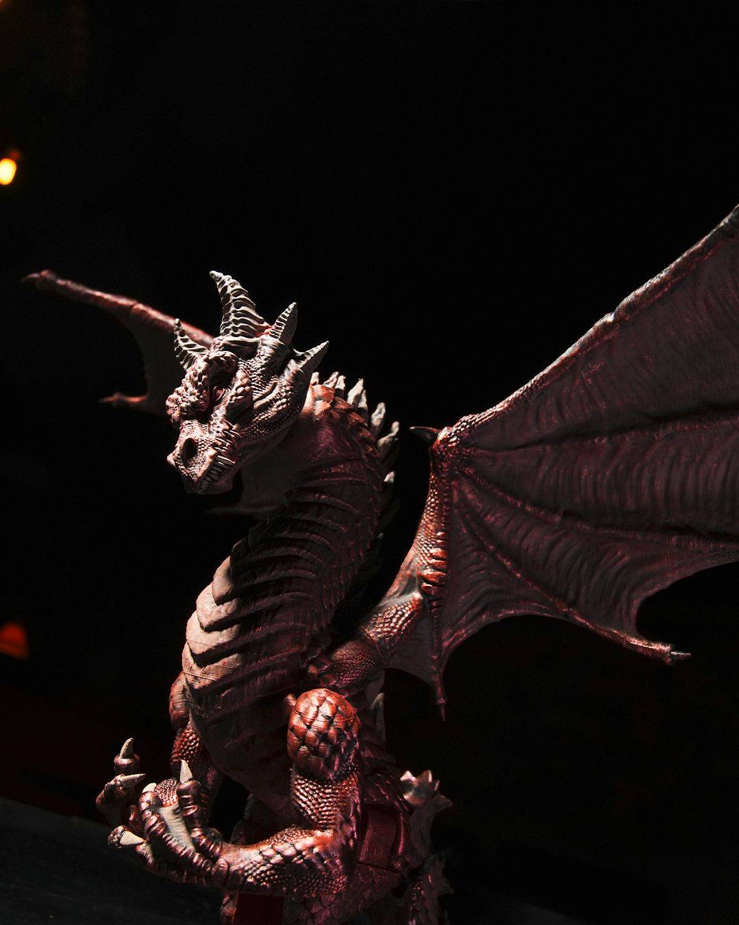 a statue of a dragon is shown in the dark