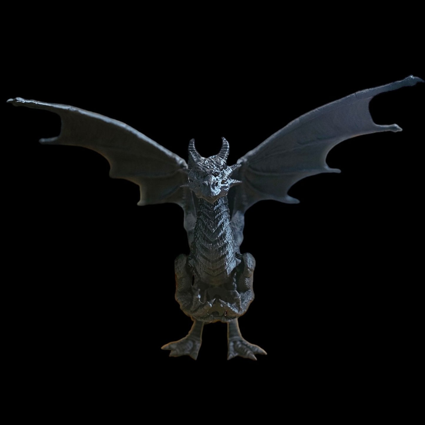 a statue of a dragon on a black background