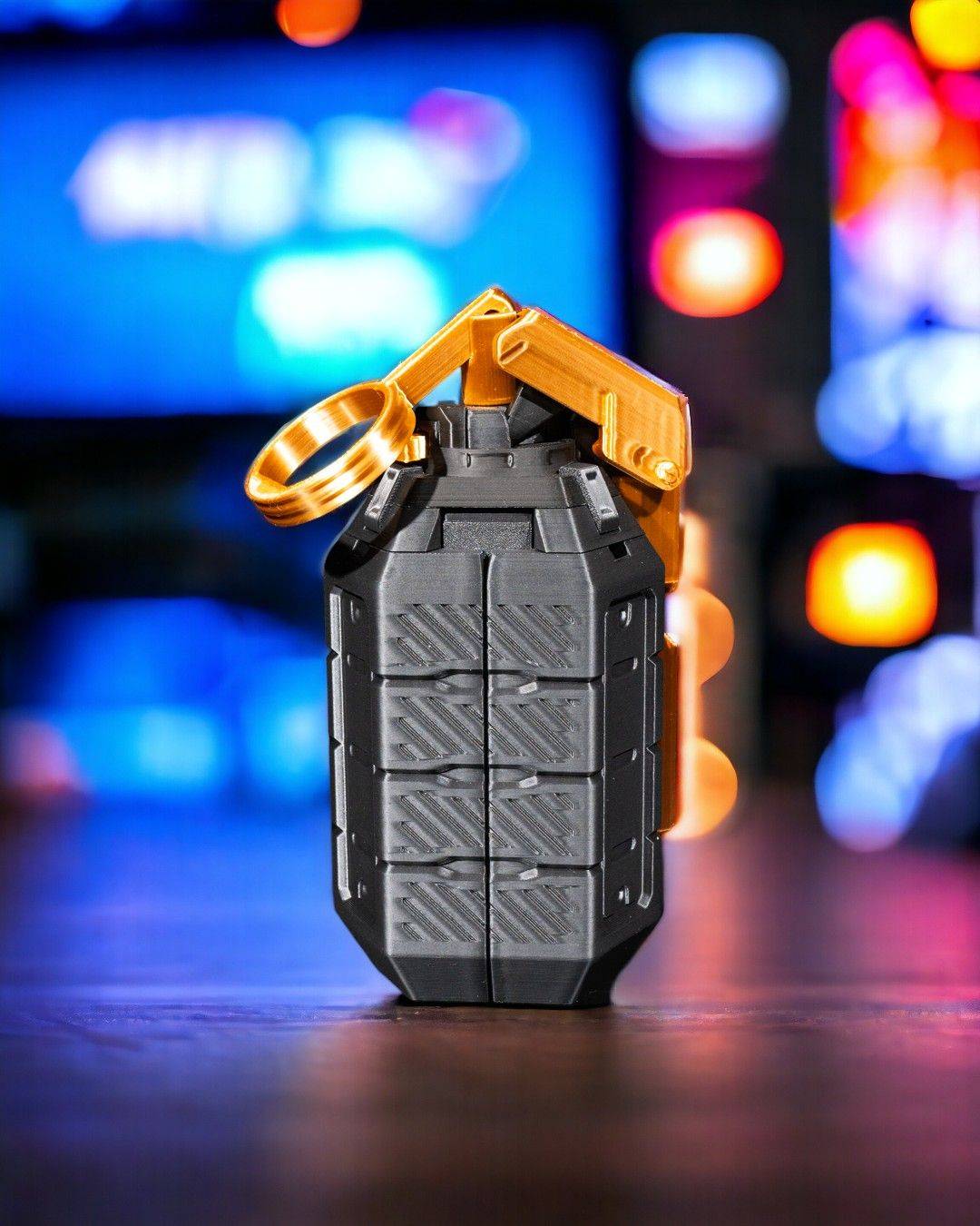 a keychain shaped like a cell phone sitting on top of a table