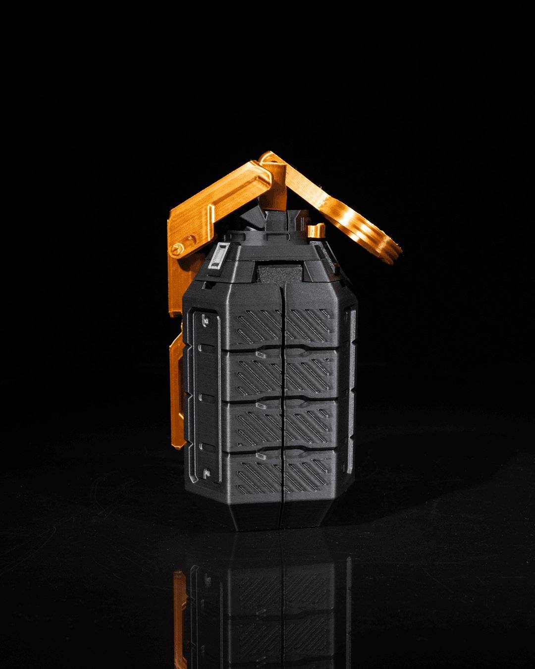 an orange and black object on a black surface