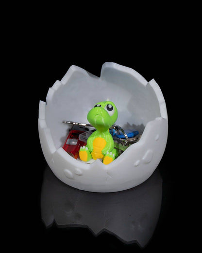 a small toy turtle in an egg shell