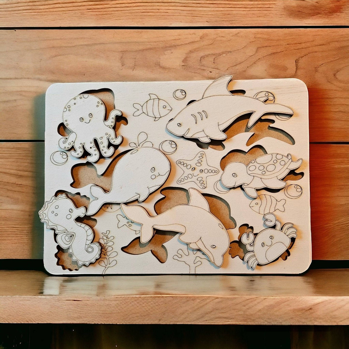 a close up of a wooden cutting board with animals on it