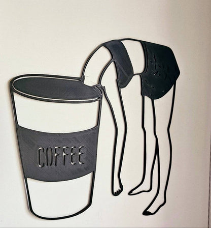 a picture of a coffee cup hanging on a wall